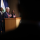 U.S. Attorney General Merrick Garland (C) speaks at a press conference with EPA Administrator Michael Regan (L) on May 5, 2022, in Washington, DC.